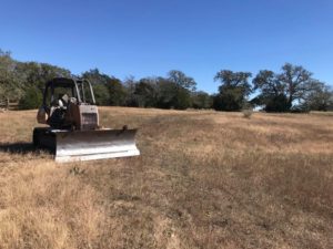 IMAGE OF LAND Clearing tractor by rm land clearing and demo in austin privacy policy