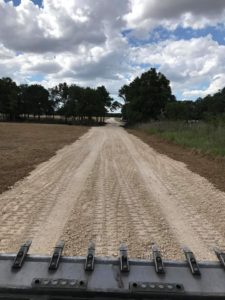 image of land clearing services one mile long private road in ausitn texas best affordable